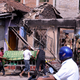 Sri Lankan police move the body of a dead man following riots in Kandy, Sri Lanka, on March 6th, 2018.